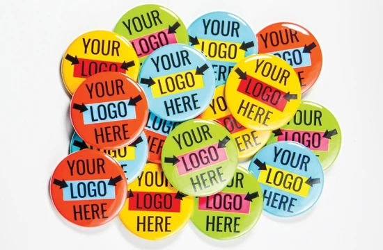 A set of colourful 38mm button badges with your logo here printed on them. Printed by Everybody Loves Badges.